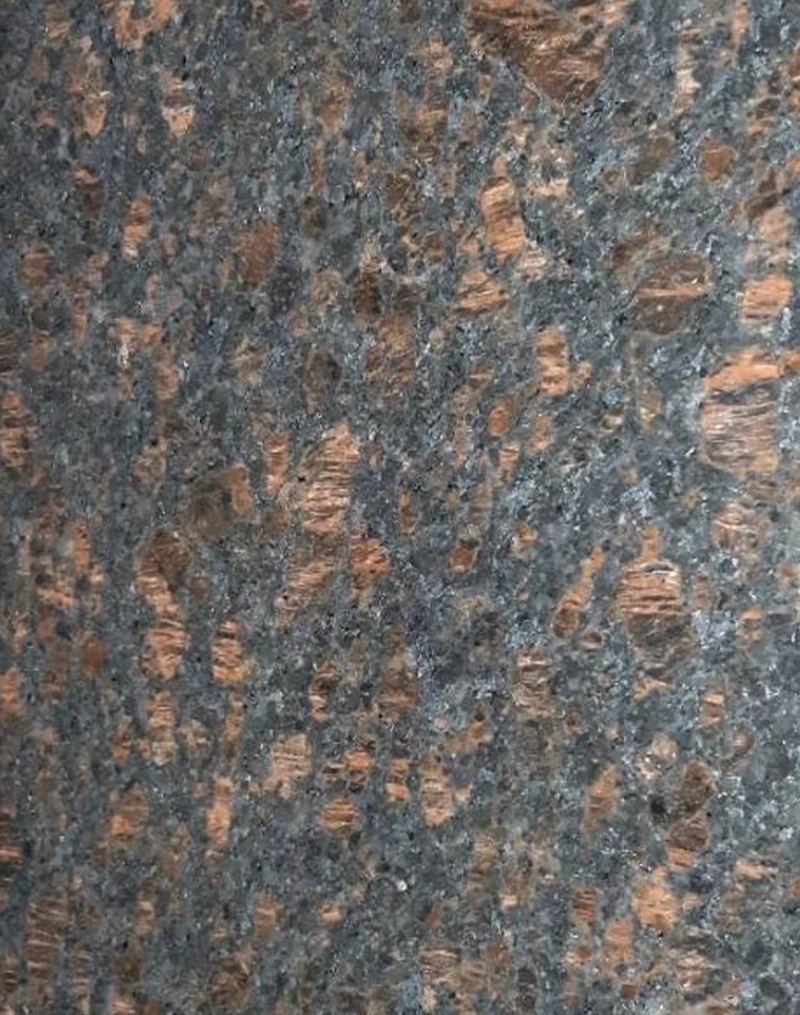 Coffee Pearl granite slab with subtle speckled pattern and glossy finish